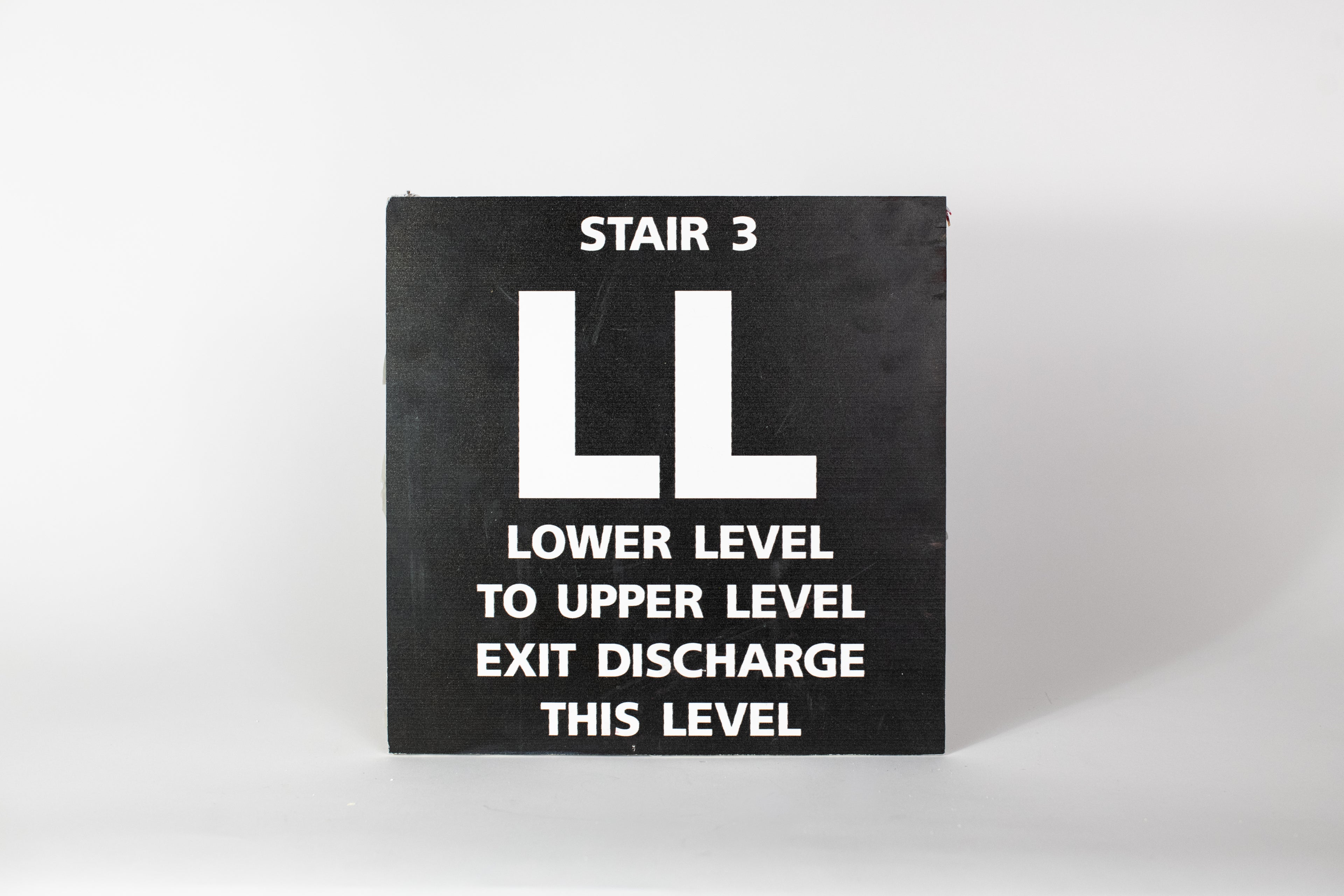 Stair 3 - LL Lower Level to Upper Level Sign