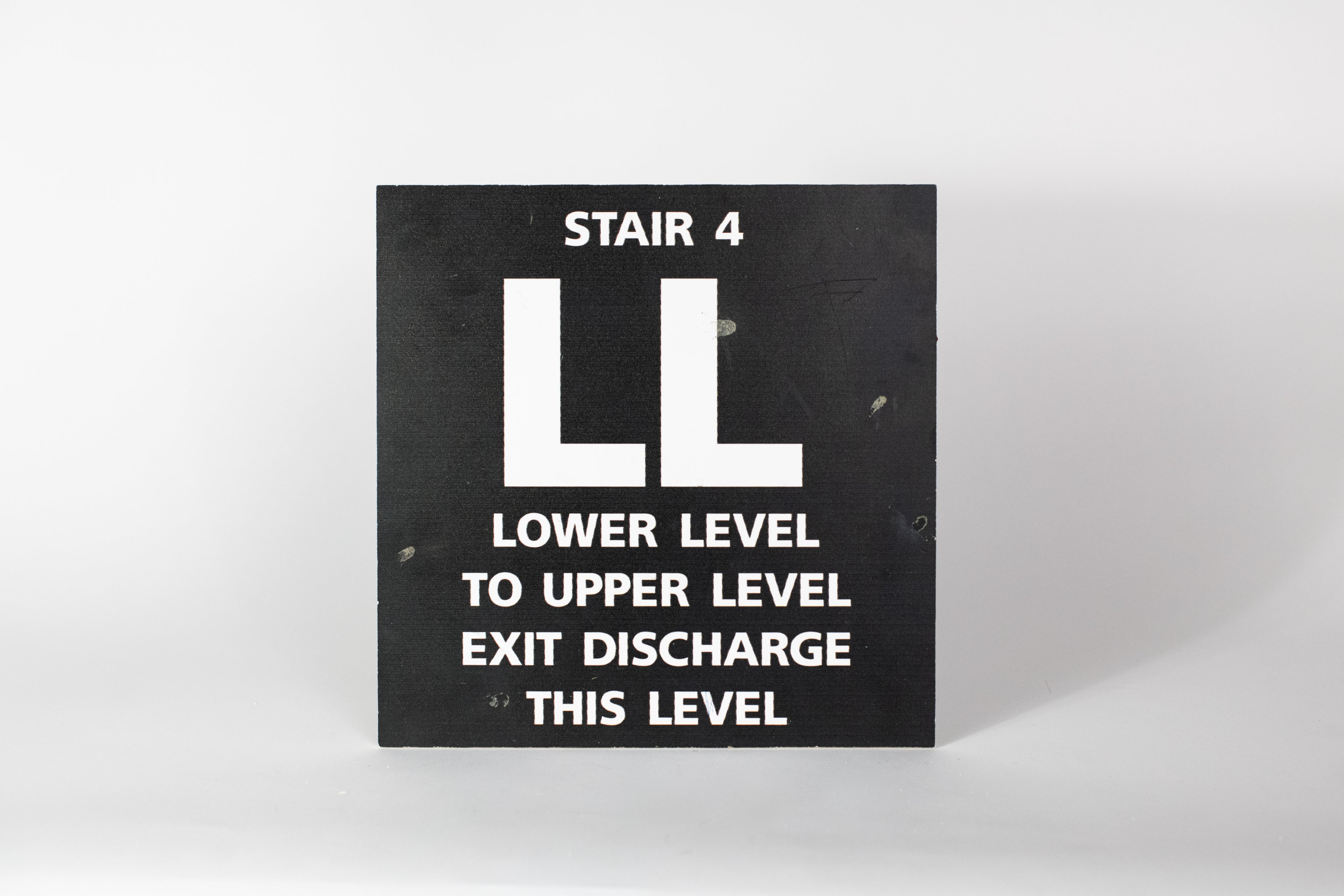 Stair 4 - LL Lower Level to Upper Level Sign