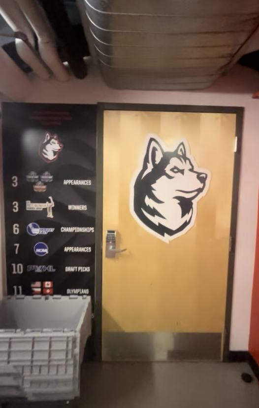 Auction Item: Women’s Husky Logo From Locker Room Door